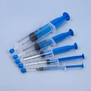 oral feeding syringe with tip cap