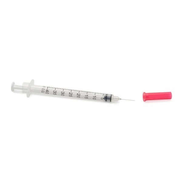 insulin syringe with pink safety cap
