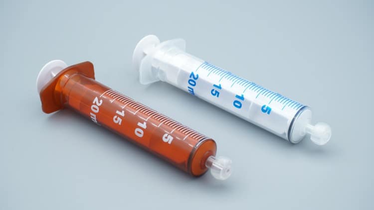 medical-waste-disposal-container-with-used-oral-syringes-following-proper-safety-protocols