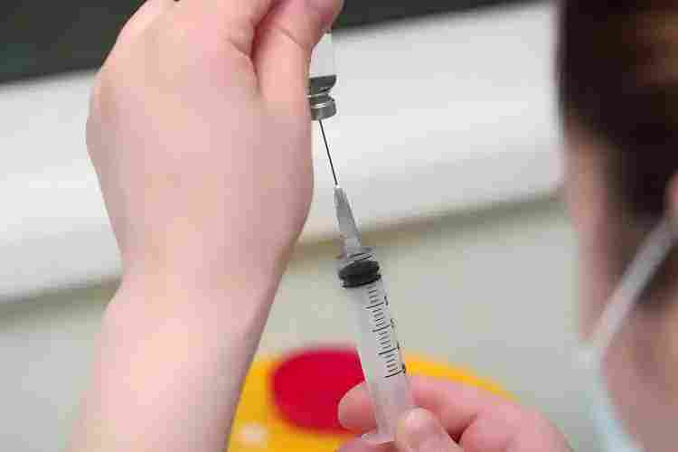 healthcare-professional-selecting-appropriate-syringe-size-for-patient-medication-administration