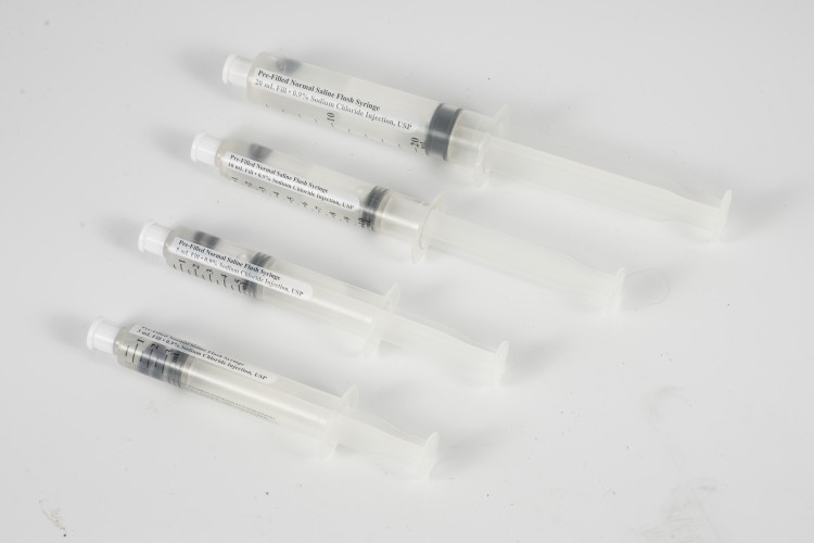 prefilled-medical-syringes-arranged-in-sterile-packaging-pharmaceutical-production
