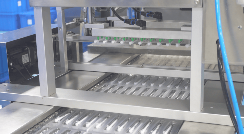 automated syringe packaging line medical device manufacturer
