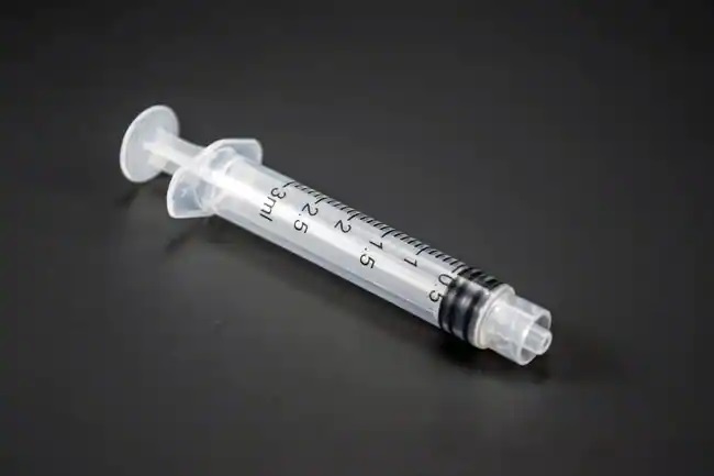 Disposable 3-part syringe 3ml with luer lock connection in medical laboratory use
