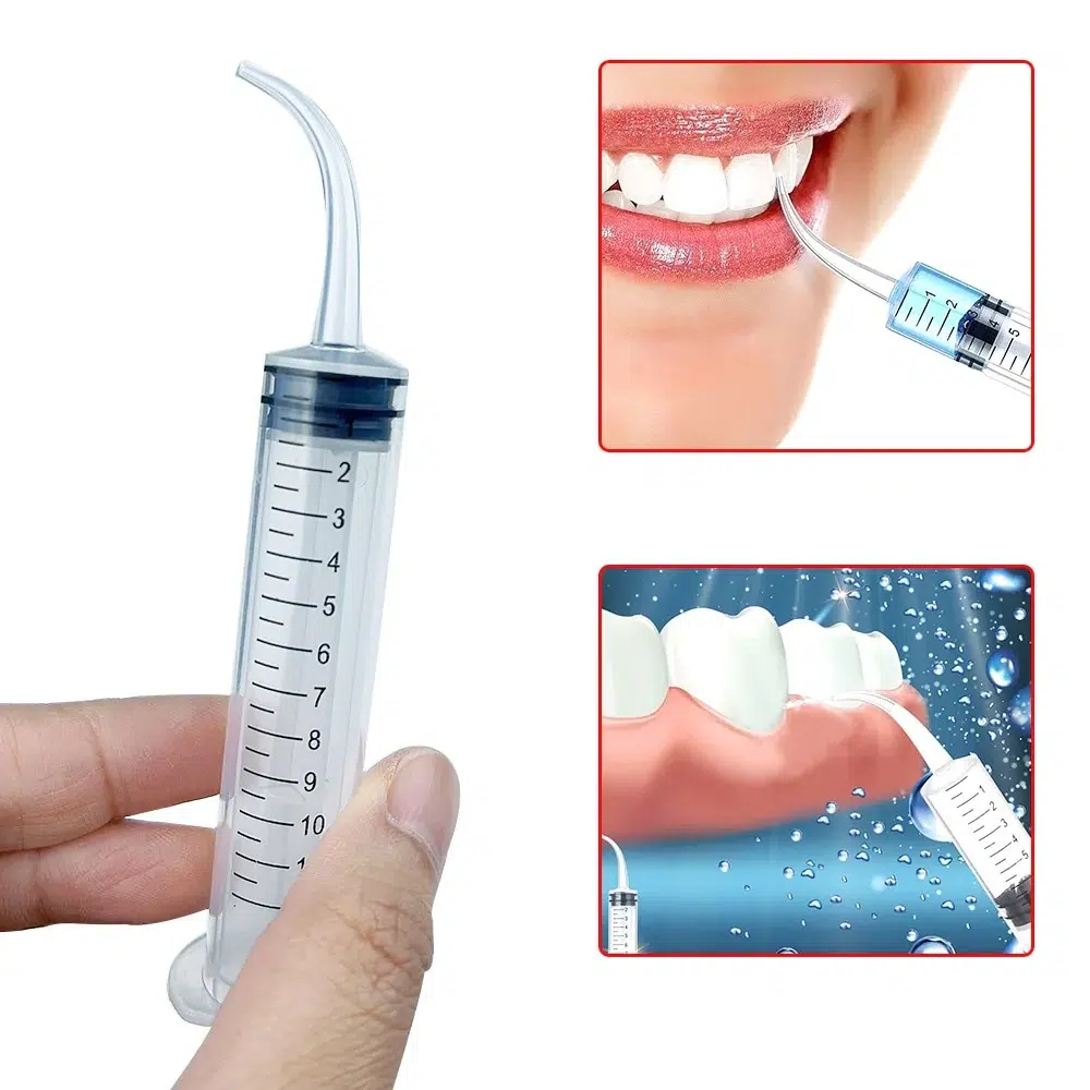 Dental syringe in use for surgical site irrigation and post-operative care application
