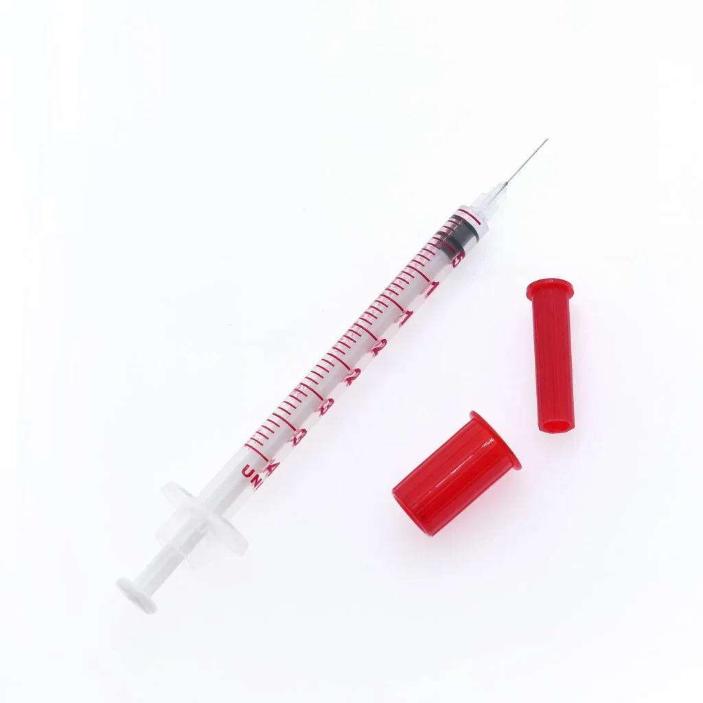 The Complete Guide to Insulin Syringe Manufacturing: Technology, Quality Standards, and Clinical Applications Insulin syringe with red color-coded cap featuring ultra-fine 29G 30G 31G 32G needle for pain-free injection