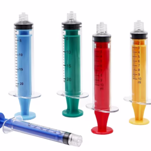 Complete range of custom polycarbonate syringes in blue green red yellow colors for medication safety protocols