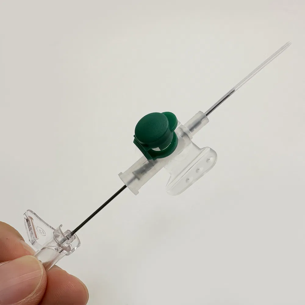 Hypoallergenic safety IV cannula in green with integrated winged grips and self-sealing injection port for medical use