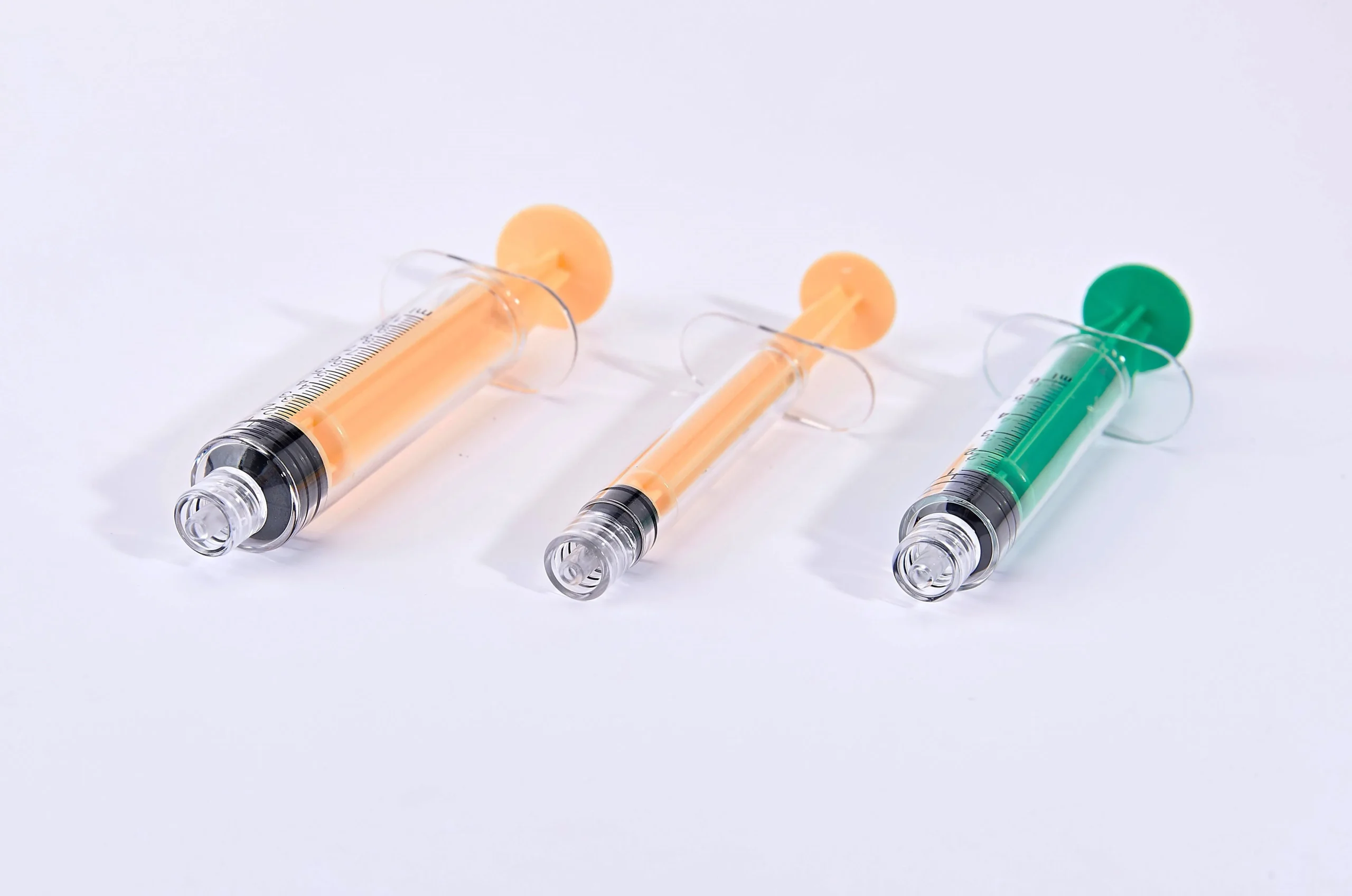 Yellow polycarbonate syringe with ENFit connector designed for safe enteral feeding applications