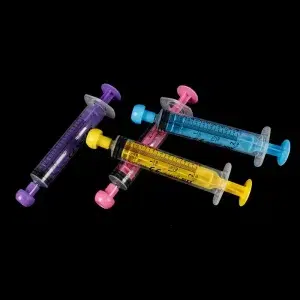 Color-coded disposable animal feeding syringes set for puppies kittens and small animals liquid medicine