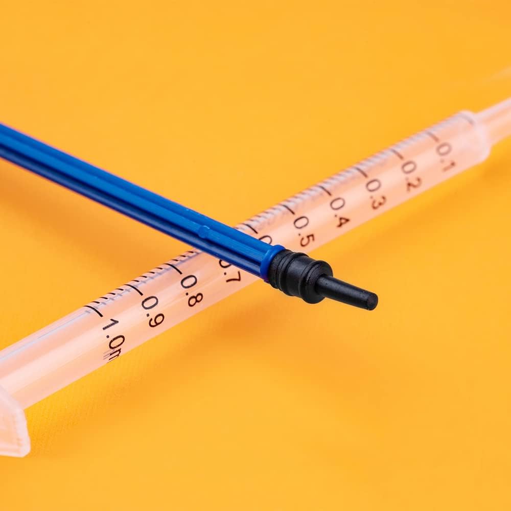Close-up of Luer slip tip nozzle on disposable plastic syringe for precise liquid dispensing