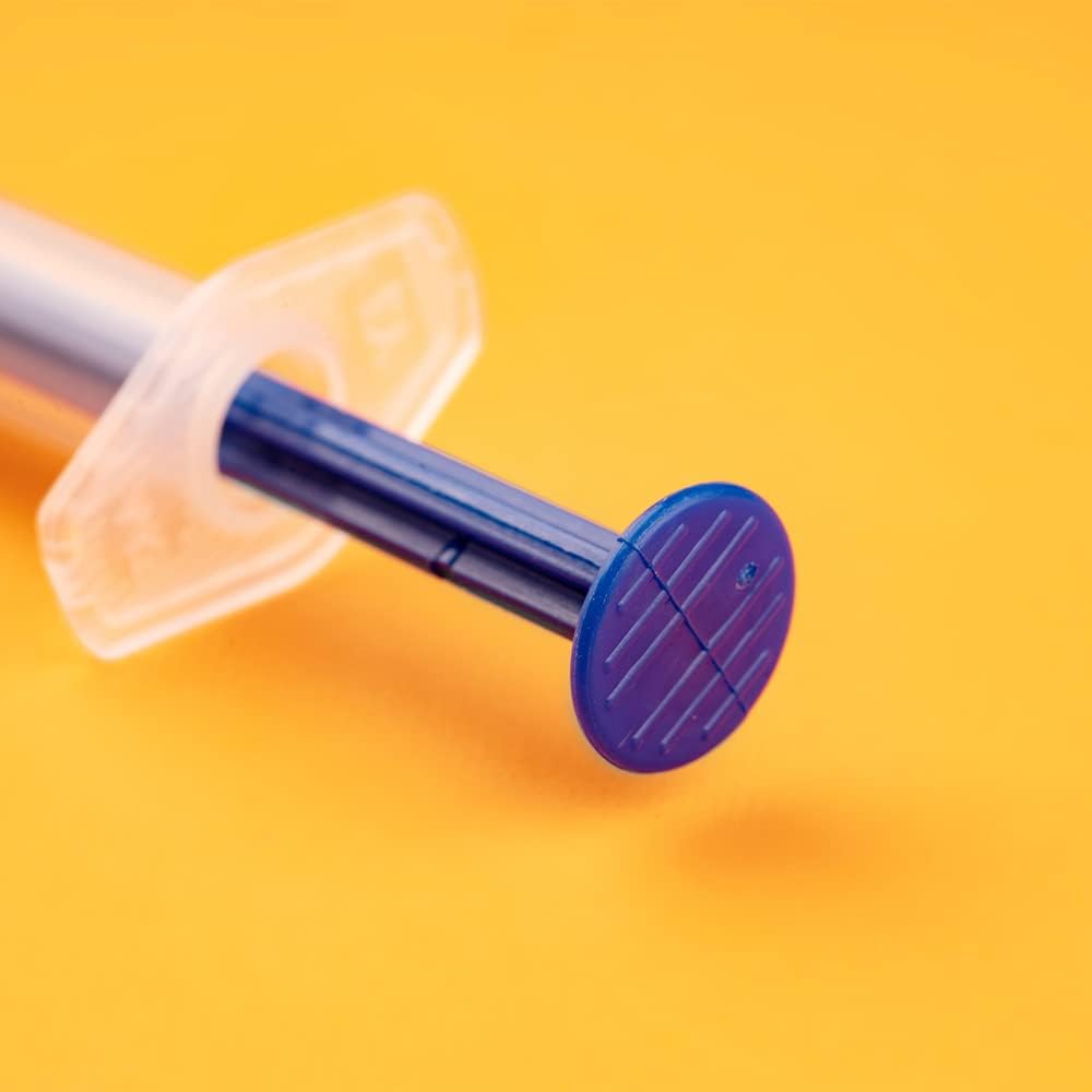 Ergonomic plunger handle of disposable sterile syringe showing smooth-action design for precise control