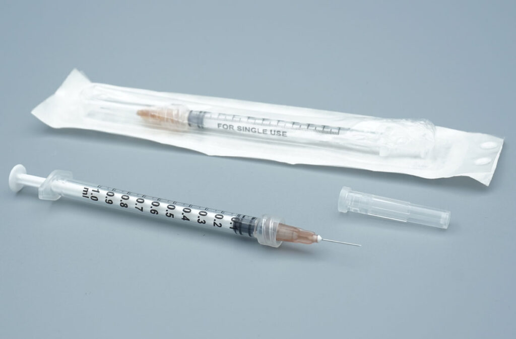 Stacked cartons of 1ml Luer Lock sterile syringes 100 pack bulk export