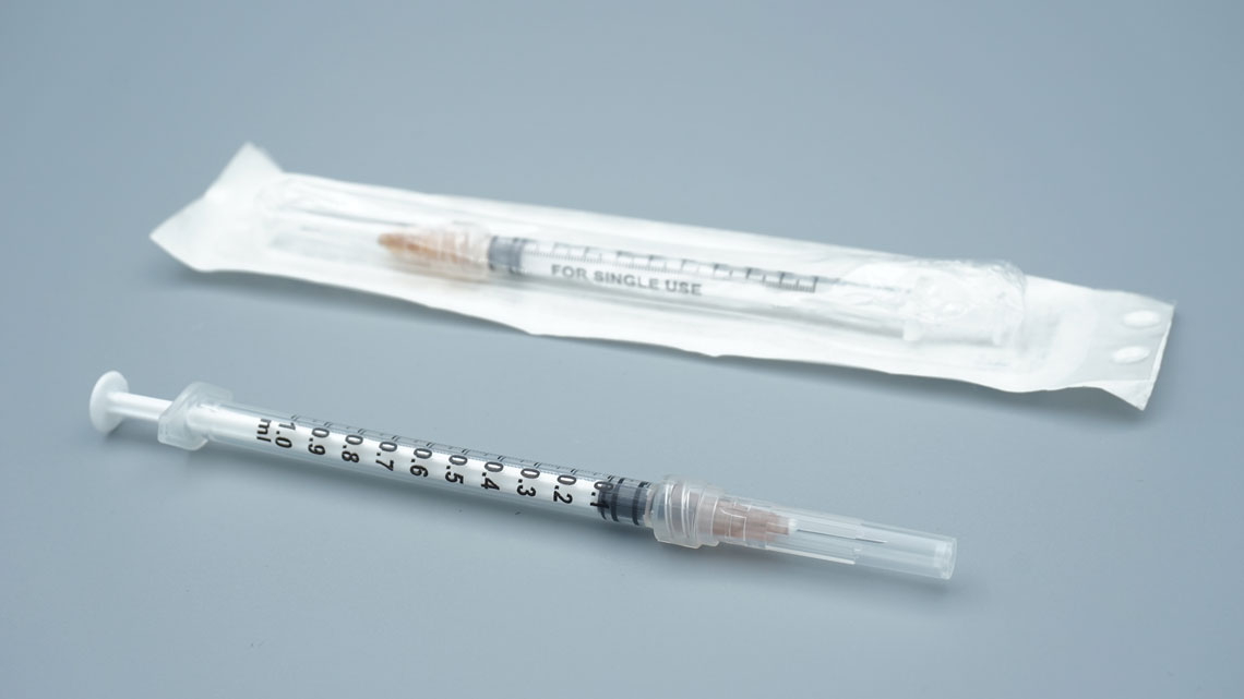 1ml disposable sterile syringe packaging showing expiry date and lot number