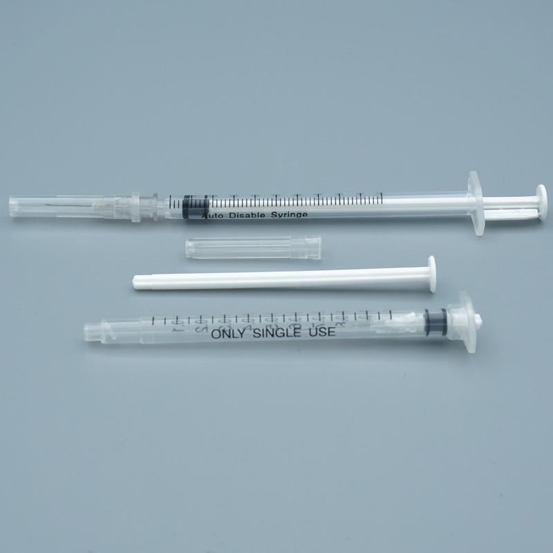 Retractable Safety Syringe - Luer Lock Retractable Needle Safety Syringes Retractable safety syringe needle retraction mechanism close-up